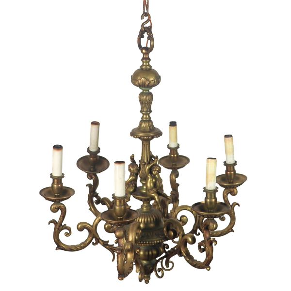 French chandelier in gilded and chiseled bronze with Empire motifs and small sculptures of cherubs, 6 lights