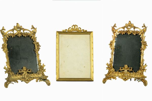 Three picture frames in gilded and chiseled bronze