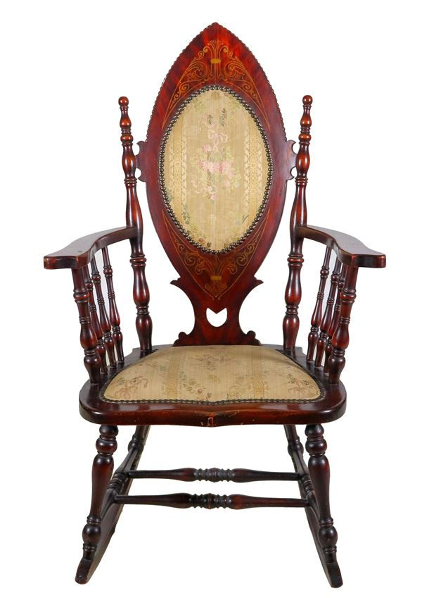 Liberty rocking chair in walnut with inlaid shield back, uprights with turned columns and cover in flowered fabric