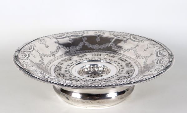 Ancient oriental round-shaped brazier in silver, entirely chiseled and embossed with geometric scrolls and floral garlands, gr. 1260