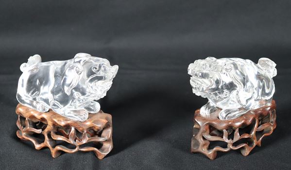 Pair of Chinese crystal "Foo Dogs", supported by teak wood bases