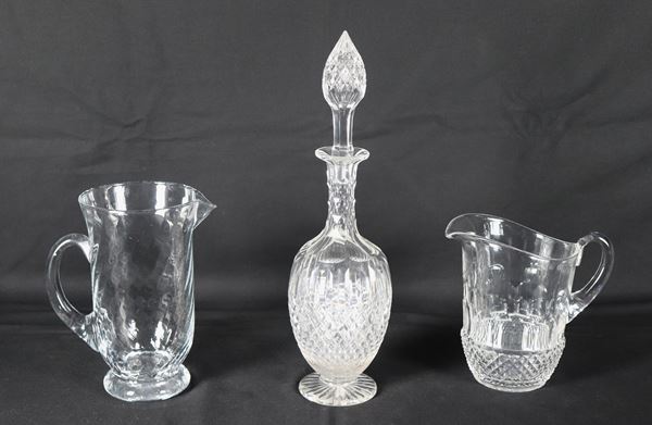Lot in worked crystal of two jugs and a bottle (3 pieces), the bottle has slight chipping at the base