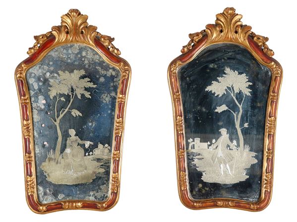 Pair of Venetian mirrors in gilded and patinated wood, with ancient mercury mirrors engraved with landscapes, lady and knight. The mirrors have some defects