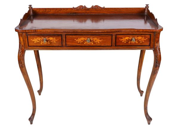 Antique walnut writing table, with railing on the top, three drawers inlaid with floral scrolls and four curved carved legs