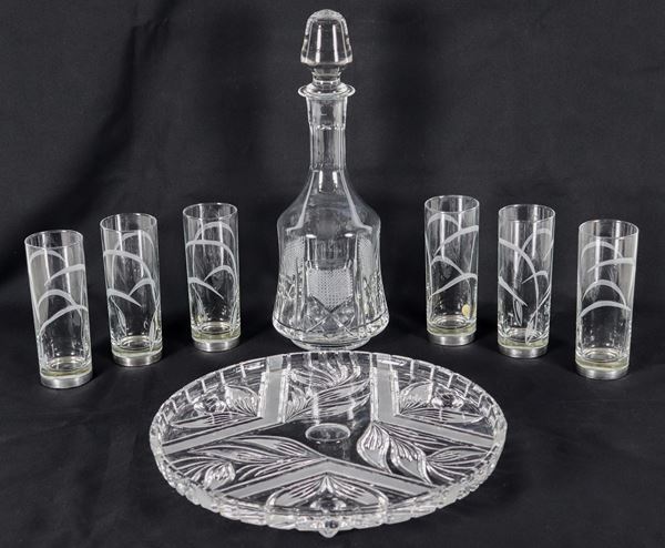 Lot in crystal and glass of a bottle, six glasses with silver-coated bases and a round tray, different manufactures (8 pieces)