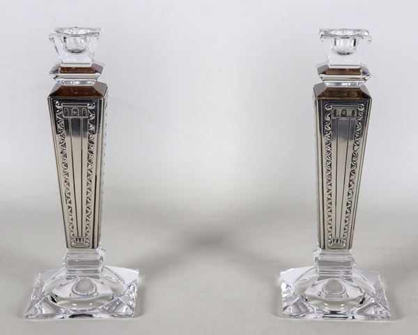 Pair of quadrangular crystal candlesticks, covered in chiselled and embossed 925 silver, marked Le Perle. One has slight chips on the edge