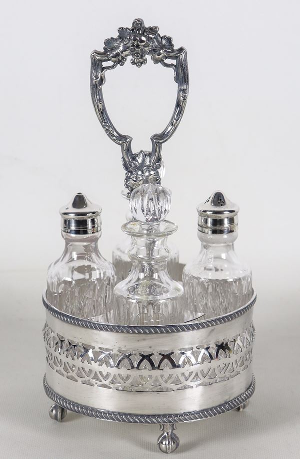 Ancient English cruet in chiseled and embossed Sheffield with pierced railing, two ampoules and two crystal bottles