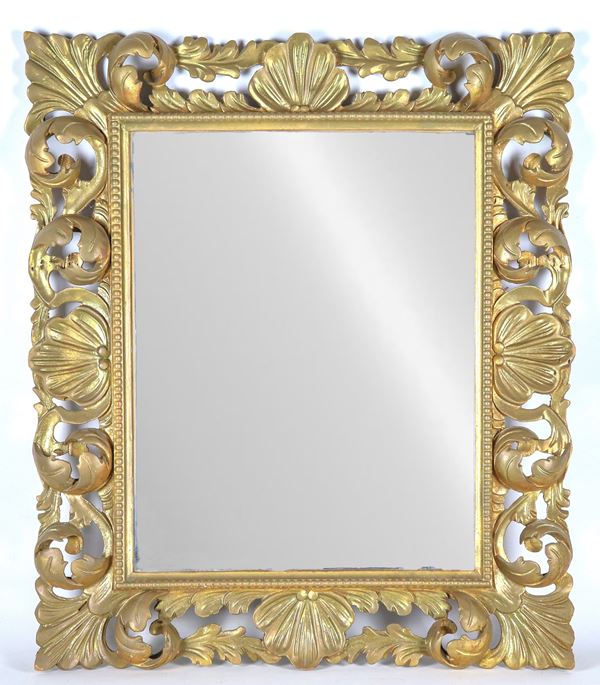 Mirror in gilded wood carved with leaf and shell motifs