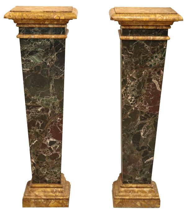 Pair of herms in antique yellow and black and white Aquitaine marble. Manufacture, late 19th - early 20th century