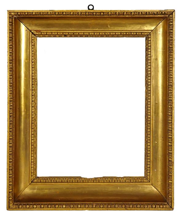 Ancient Tuscan "cassette" frame from the Empire period, in gilded and carved wood. One door leaf is missing