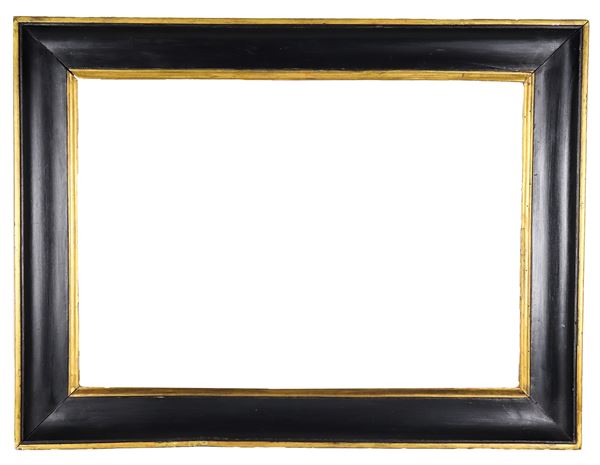 Ancient ebonized wood frame with gilded profiles