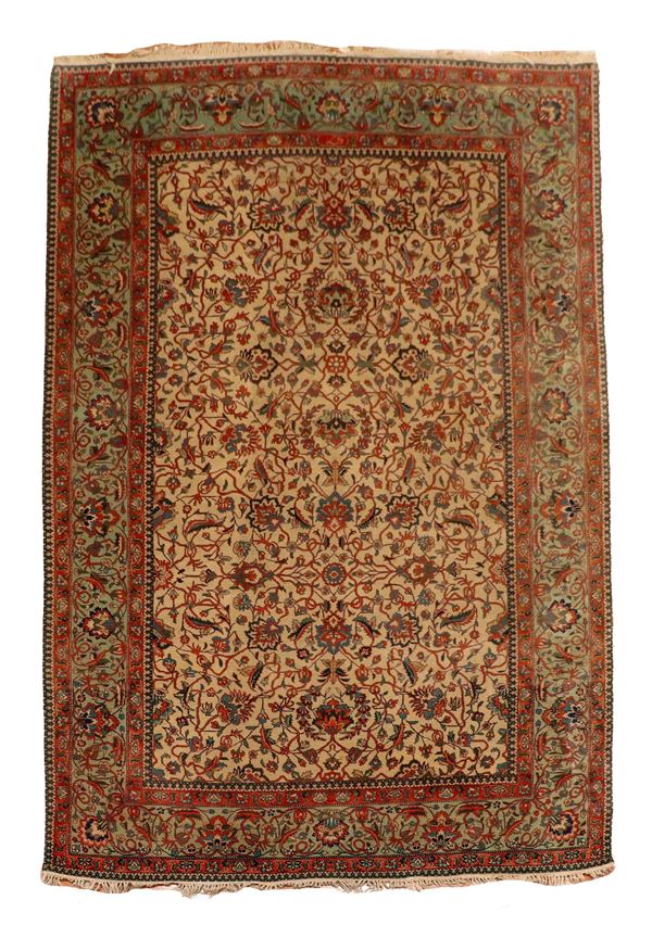 Zaranj Persian carpet with geometric floral design on a havana background and green border, M 2.68 x 1.64