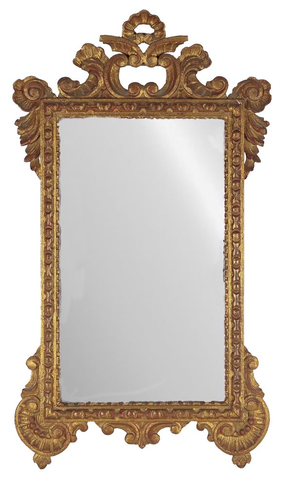 Small mirror in gilded wood and carved with Louis XV motifs, mercury mirror