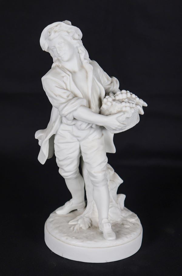 "Grape seller", ancient French sculpture in white biscuit