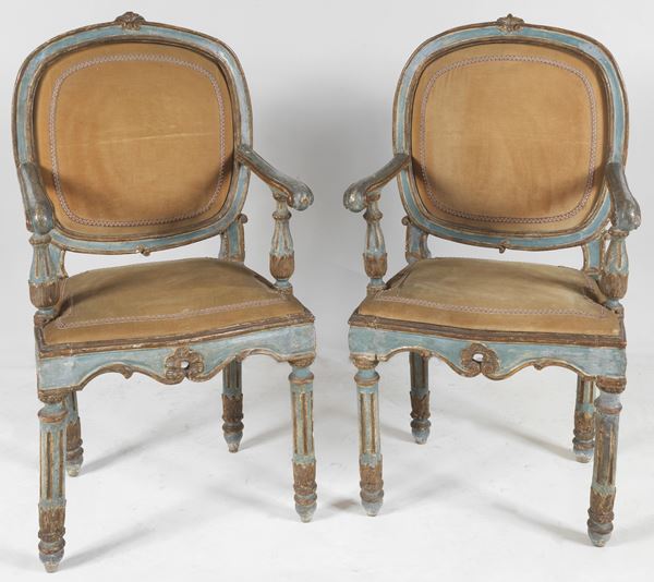 Pair of antique Louis XVI armchairs from the Marche, in lacquered and gilded wood with semi-oval backs and four fluted legs, cover in Havana velvet
