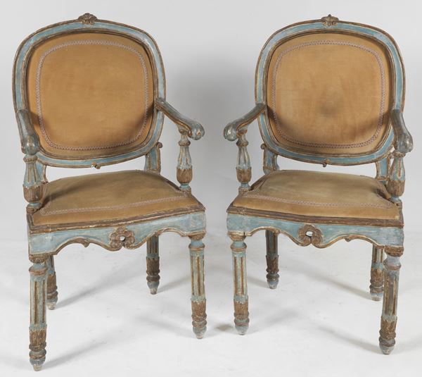 Pair of antique Louis XVI armchairs from the Marche, in lacquered and gilded wood with semi-oval backs and four fluted legs, cover in Havana velvet