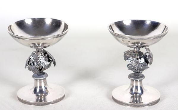Pair of ancient small silver salt shakers, chiselled and embossed with grape shoots and beading, gr. 235. Austro-Hungarian stamps 1813.