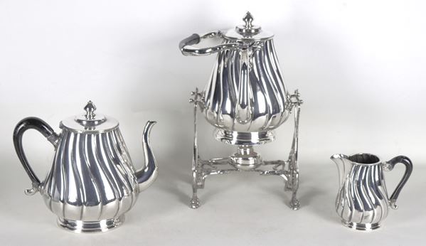 Tea and coffee service in silvered metal, embossed and chiselled, with ebonized wooden handles, marked Finzi-Firenze (3 pcs)