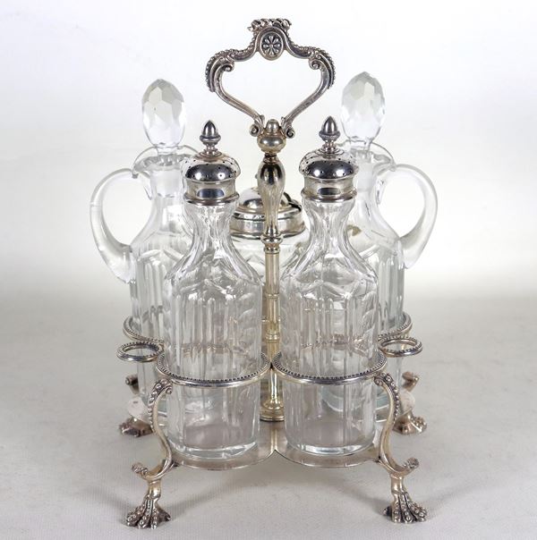 Ancient English cruet in chiselled and beaded Sheffield, with two ampoules and three bottles in worked crystal, supported by four curved feet