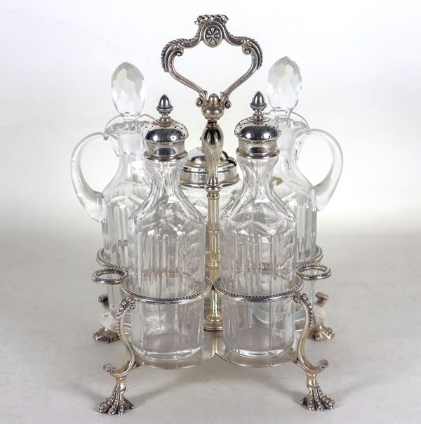 Antica cruet inglese in sheffield cesellato e sbalzato a perlinature, con due ampolle e tre flaconi in cristallo lavorato, sorretta da quattro piedini ricurvi