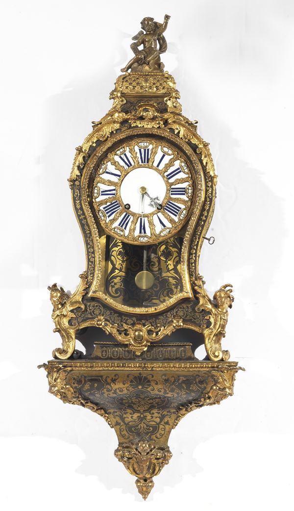 Antique wall cartel clock with shelf from the Louis White enamel dial with Roman numerals. Mid 18th century