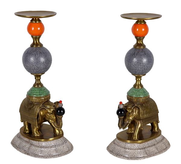 Pair of sculptures "Elephants with risers", in gilded bronze and enamels