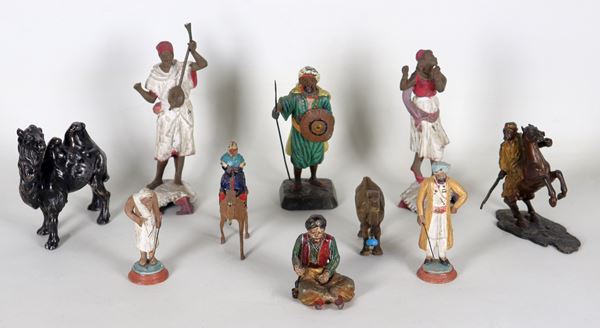 Lot of ten figurines representing "Arabs", various sizes and materials (bronze, ceramic etc.)