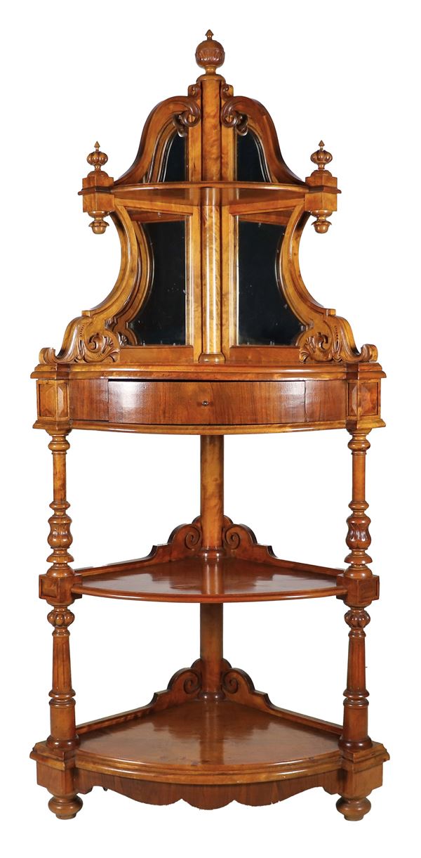 Antique Louis Philippe corner cupboard in carved walnut, with raised top in a shaped shape with mirrors, a central drawer, three shelves and uprights with turned and fluted columns, onion legs