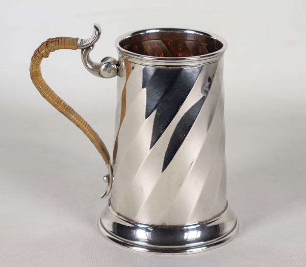 Torchon embossed silver mug with curved handle covered in wicker and vermeil interior, signed Pampaloni, gr. 380