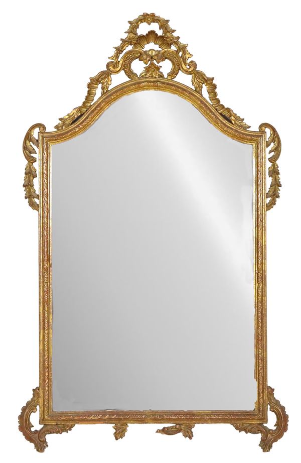 Louis XVI line mirror, in gilded and carved wood with curls and friezes, mercury mirror. Lack