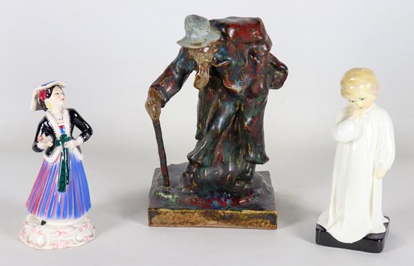 Porcelain and ceramic lot of three figurines: "Girl in costume", "Child" and "Beggar". Minor defects