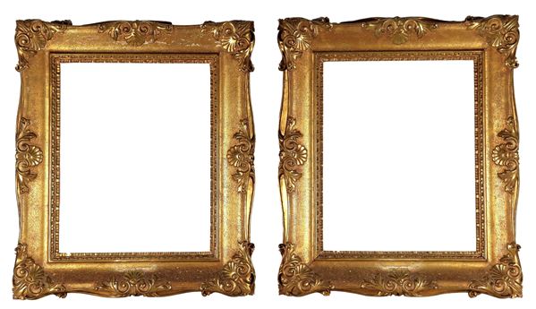 Pair of French frames in gilded wood and carved with scrolls of acanthus leaves and shells