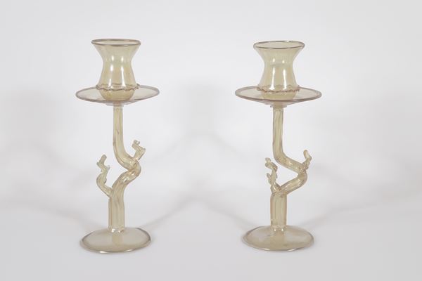 Pair of amber blown Murano glass candlesticks, with tree trunk shaped stem