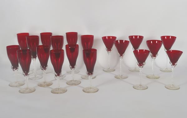 Lot of nineteen oxblood crystal glasses, with transparent stems worked in spirals, various shapes and sizes