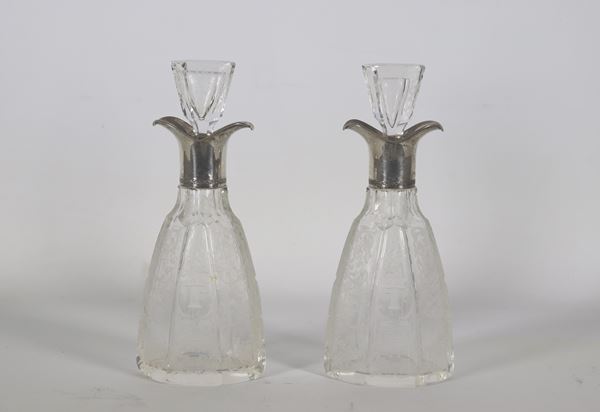 Pair of engraved crystal perfume bottles, with silver-coated necks. Manufacture Early 20th Century