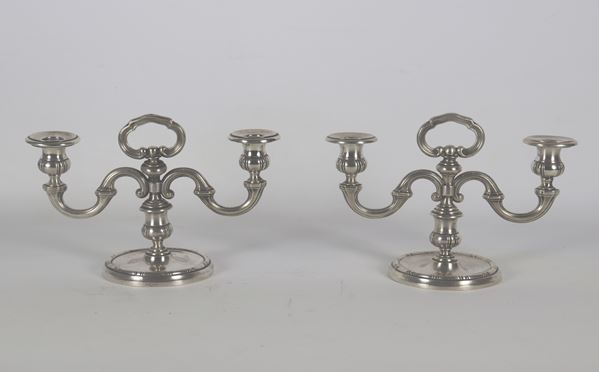 Pair of chiseled and embossed silver candlesticks with Louis XV motifs. Fascio Period stamp 1934-1944, gr. 670