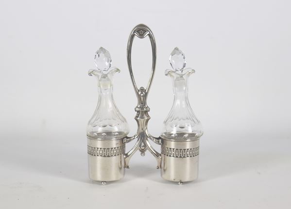 Oil cruet in silver, chiseled and embossed with Louis XVI motifs with two crystal ampoules, 124 g