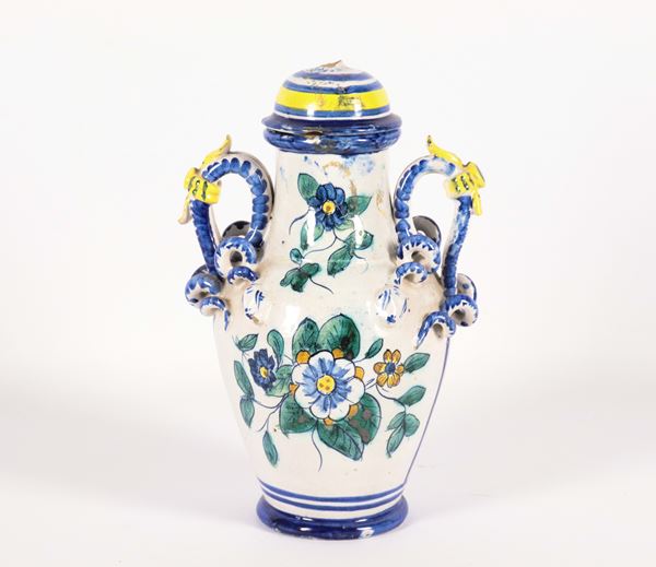 Small majolica vase with polychrome floral decorations, missing parts