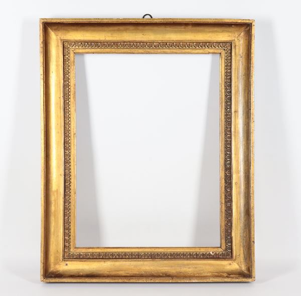 Antique Empire frame in gilded and carved wood