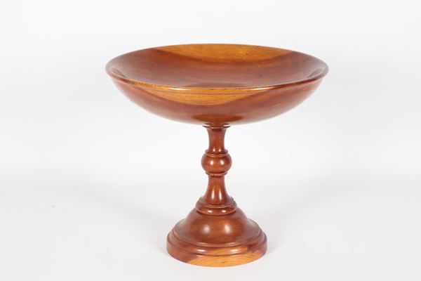 Wooden cup supported by a turned base