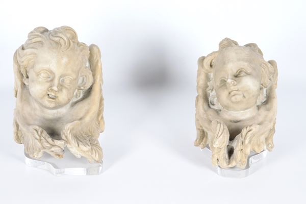 &quot;Faces of little angels&quot;, pair of small sculptures in white marble