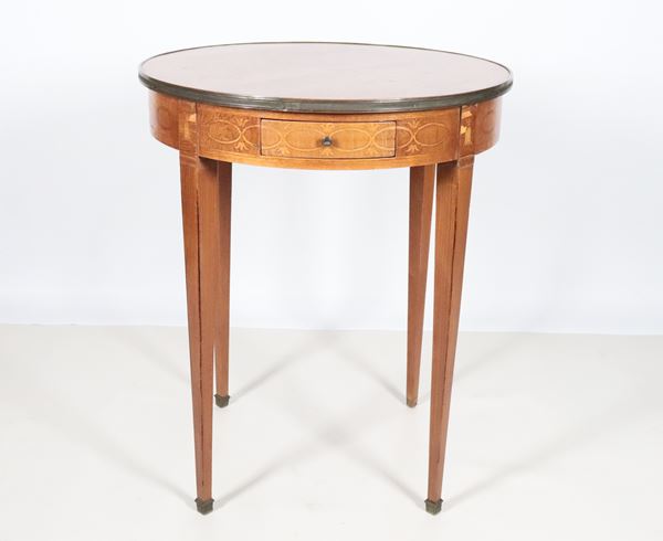 Antique French round-shaped centre table in pickled wood, with geometric pattern inlays, a drawer and four inverted pyramid-shaped legs