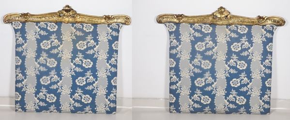 Pair of antique single bed headboards in gilded and carved wood, with a blue floral fabric cover