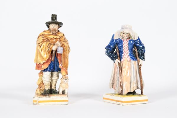 Pair of small sculptures &quot;Beggars&quot;, in enameled and polychrome porcelain from Capodimonte. Defects and breakage at the base of a figurine