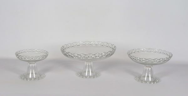 Triptych of crystal cake stands with perforated edges, one large, one medium and one small