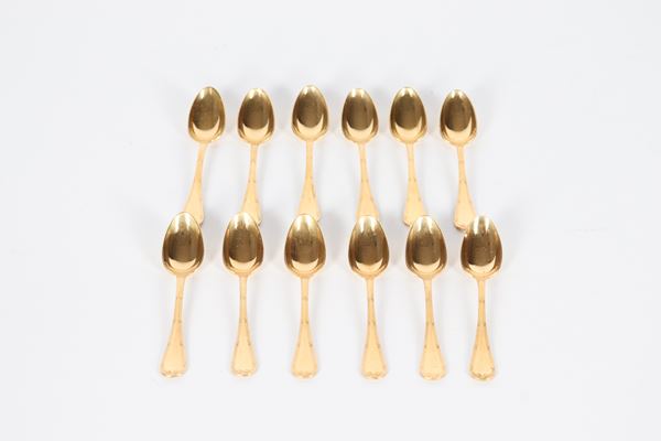 Lot of twelve coffee spoons in gold-plated and chiselled metal