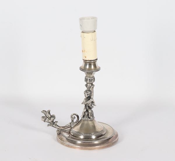 Antique silver candlestick, with sculpture of a cherub with a cornucopia and a curved flower-shaped handle, reduced to electric light, 200 g