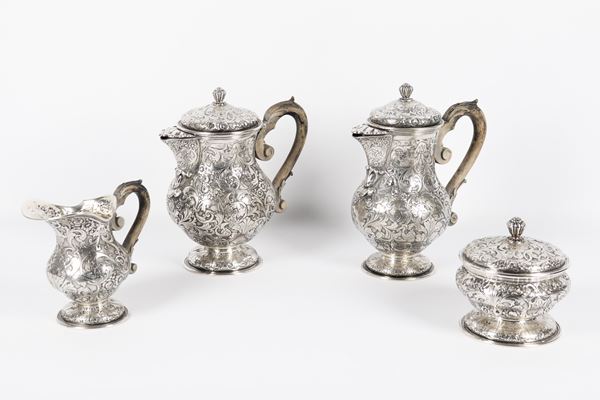 Antique silver coffee service, richly chiseled and embossed with floral scroll motifs, wooden handles worn by time (4 pcs), gr. 2280