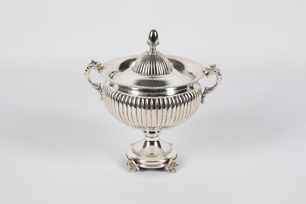 Neoclassical amphora-shaped silver sugar bowl, chiseled and embossed with pods