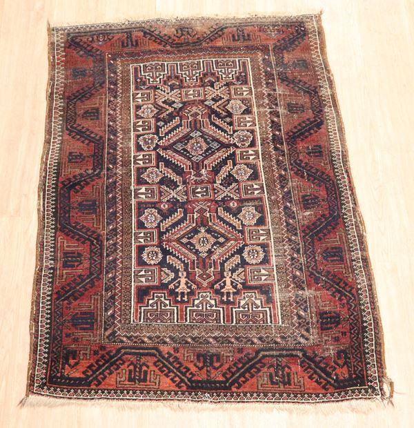 Persian Shiraz carpet with geometric designs on a red, black and brown background. Various defects